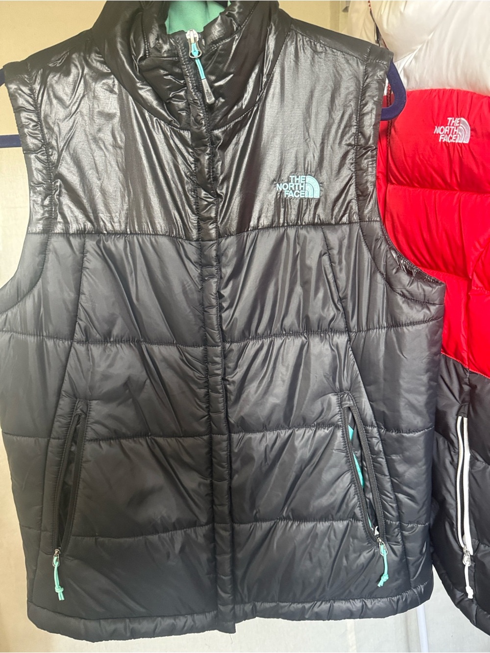 The North Face Black Puffer Vest with Teal Trim - women’s Large